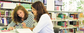 Student looking at books