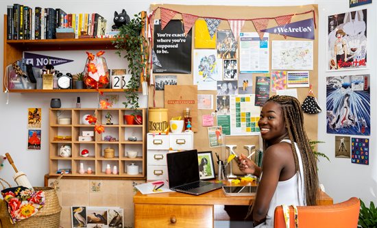 Student sitting at desk in Nightingale Hall of Residence