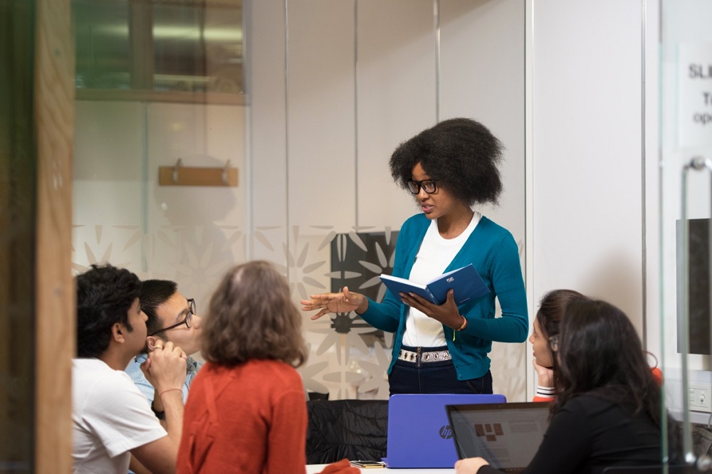 Postgraduate students in a study room