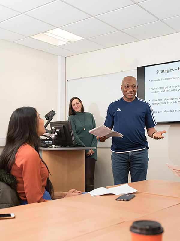 CELE students in classroom with teacher