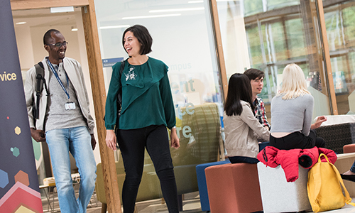 Students walk through the careers service room
