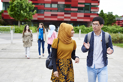 Student reviewing her finances online in a student service centre