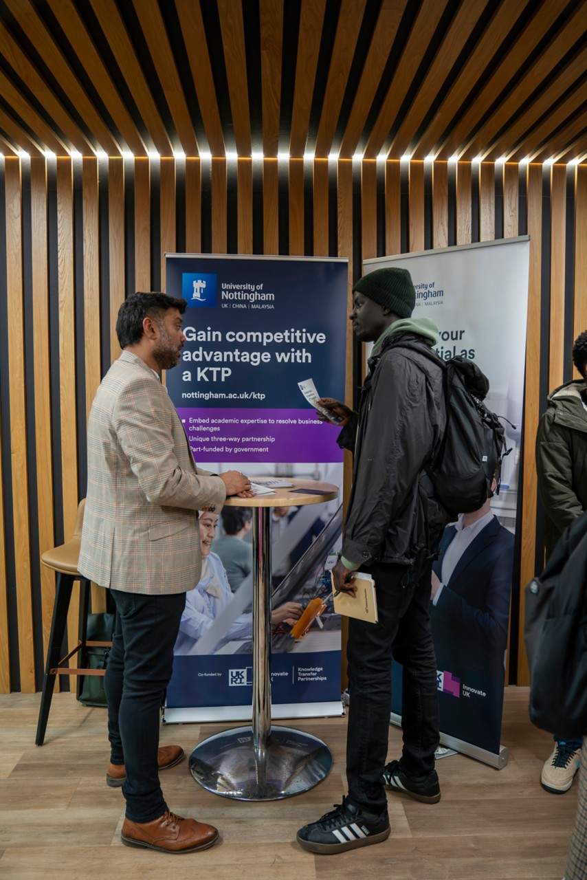 Student talking to employer at careers fair
