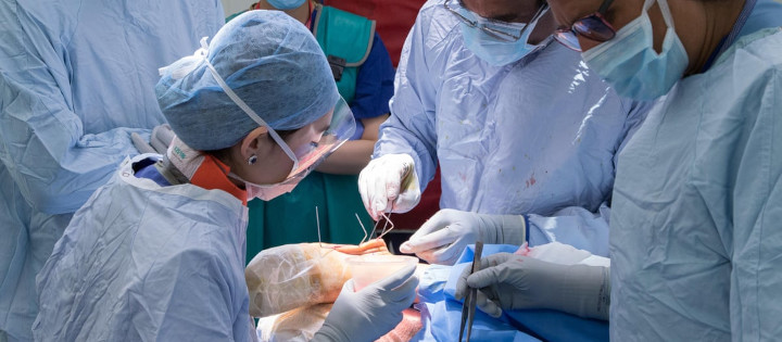 Surgeons performing brain surgery