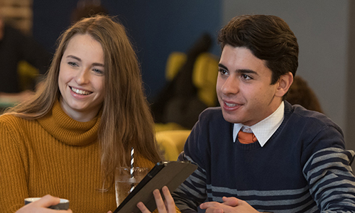 Students talking in a cafe on campus