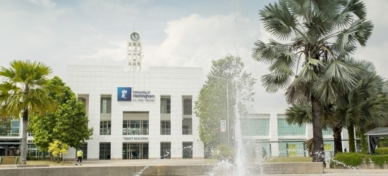 External view of Trent Building, Malaysia Campus with trees and fountain in foreground