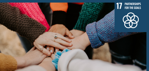 Multiple hands on top of each other in a circle