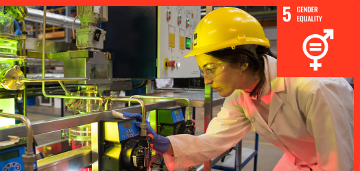 Engineer wearing a hard hat inspecting equipment