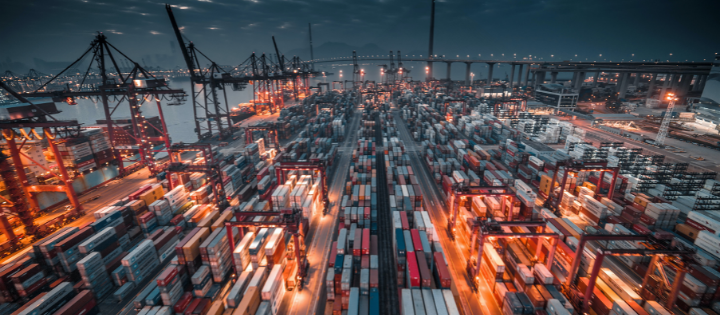 Cargo freight containers in a sea port at dusk