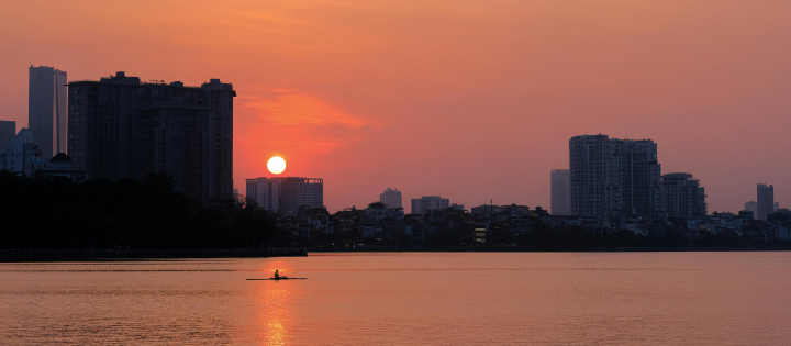 Hanoi skyline with a kayak on the delta