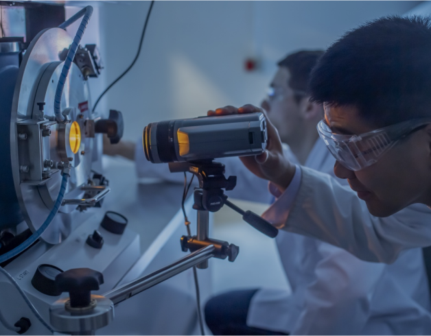 Scientists using equipment in a lab