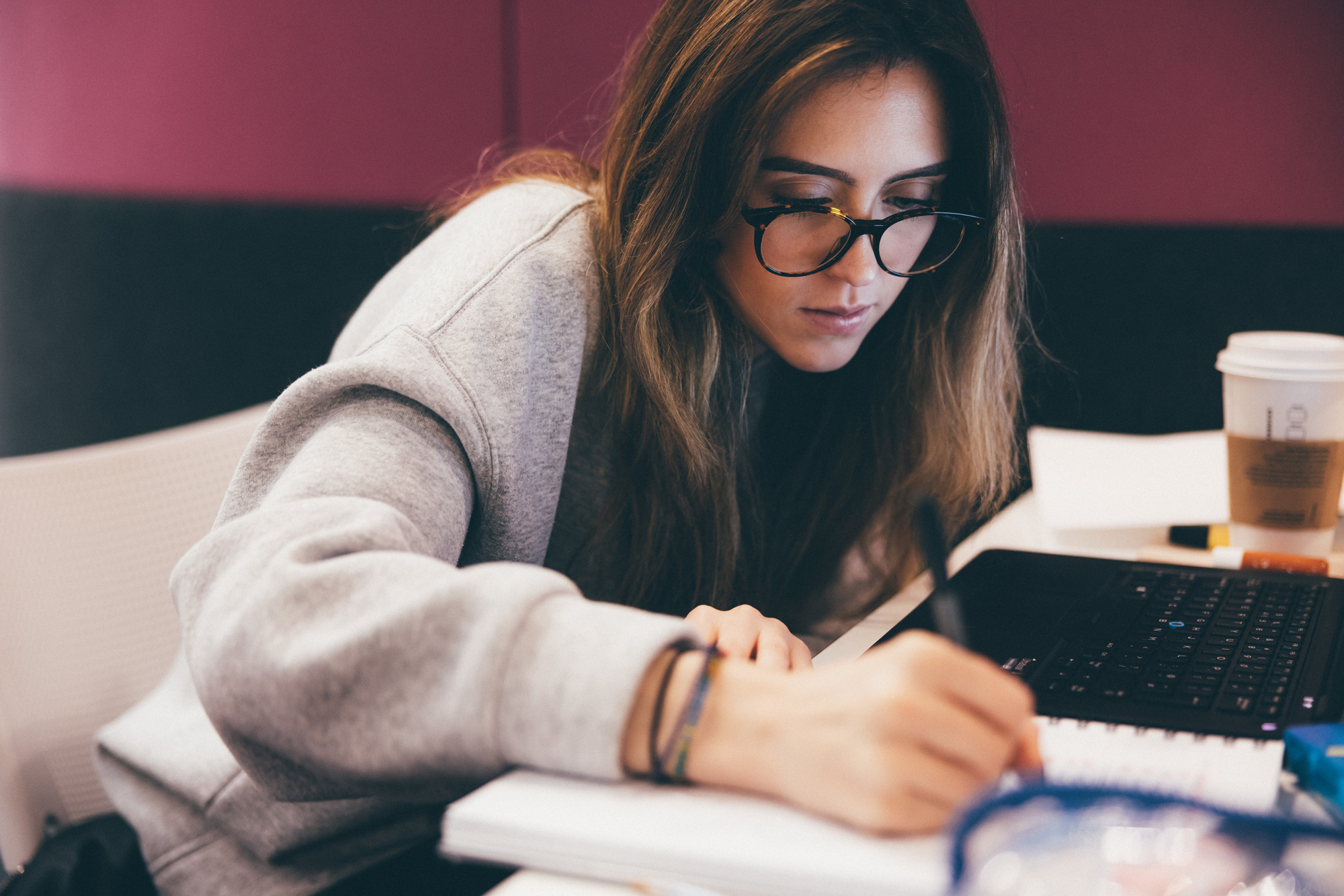 Postgraduate research students working at her desk