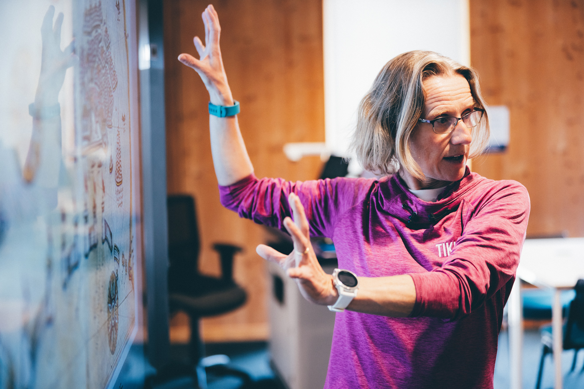 Postgraduate student presenting infront of a screen