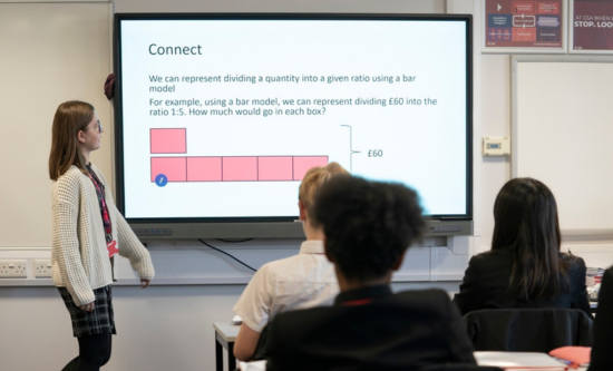Teacher teaching secondary mathematics